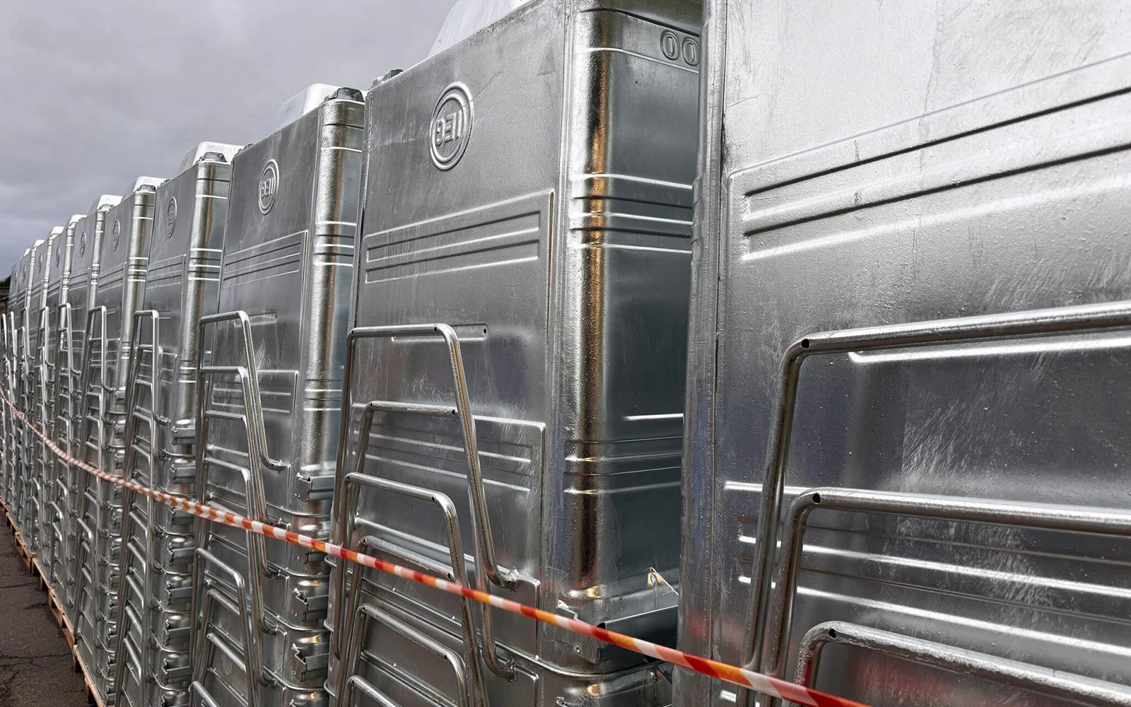 A stack of galvanised steel Taylor Continental Dumpsters