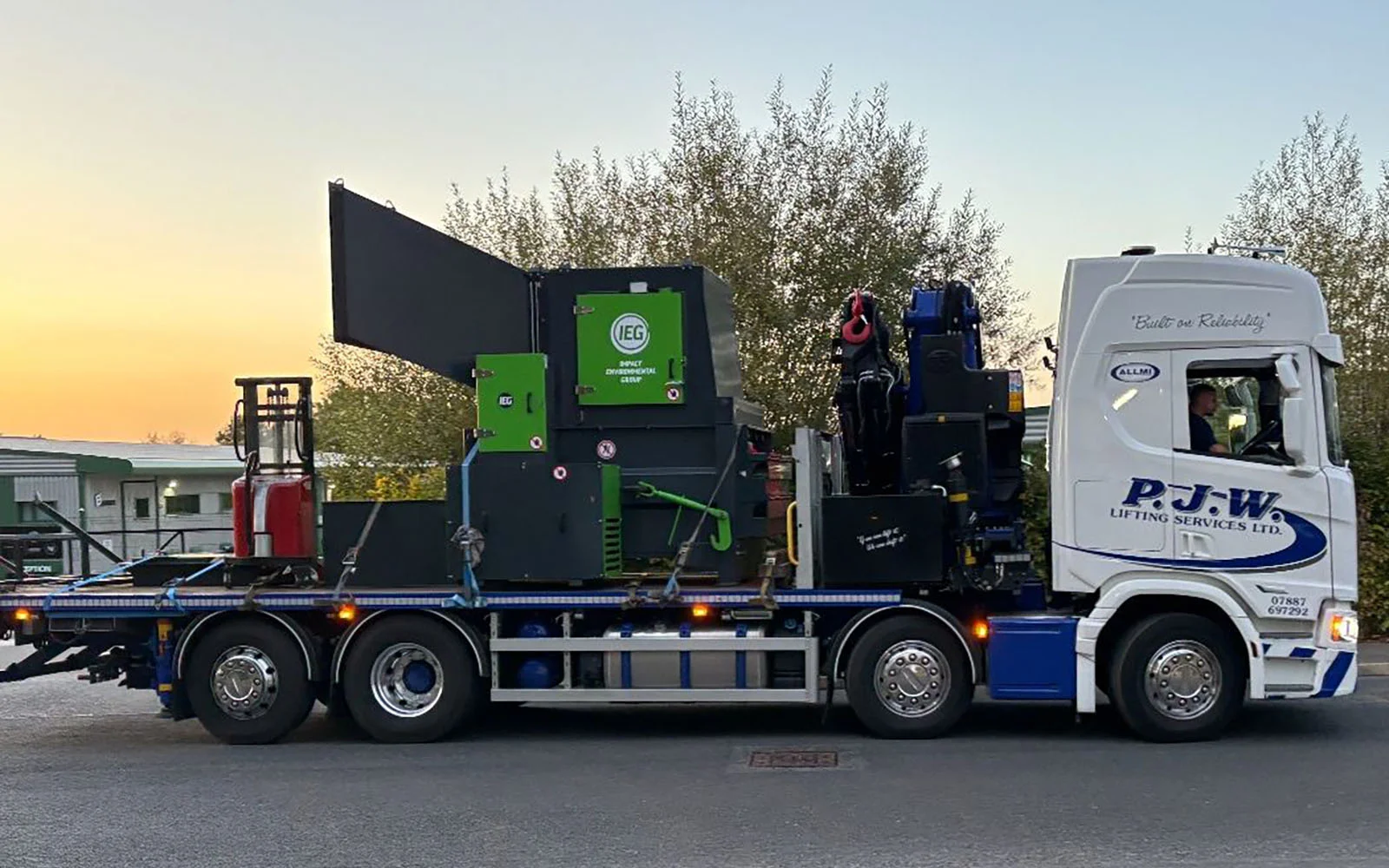 An IEG Compactor being delivered ready to install.
